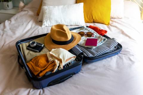 suitcase backed for a beach vacation